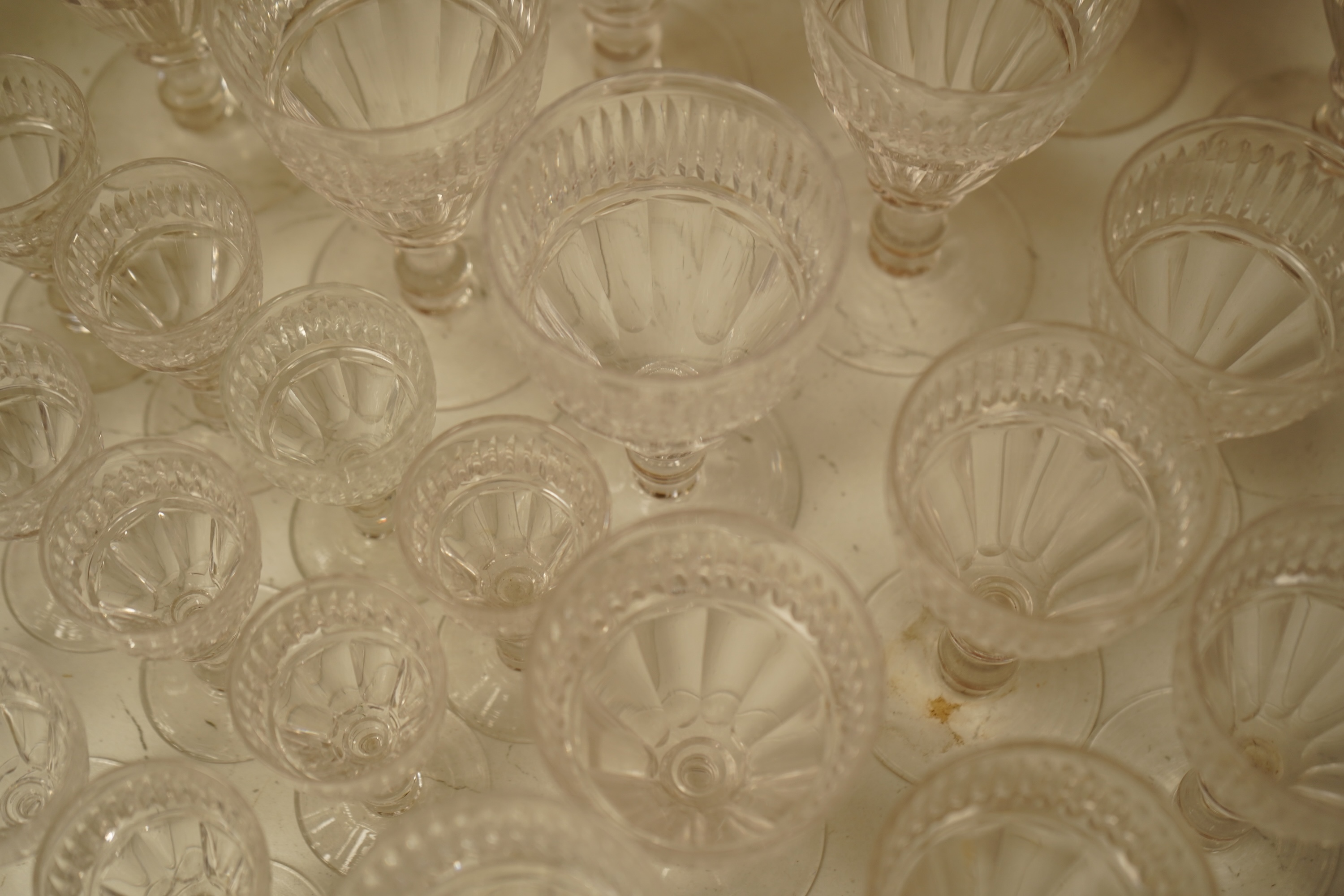 A part suite of 19th century cut glass drinking glasses, largest 13cm high